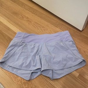lululemon pastel speed up shorts size 4 four inch, no stains other then the rips